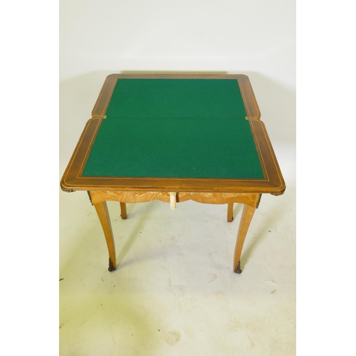 1150 - A French marquetry inlaid rosewood card table with brass mounts, the top slide back to reveal a writ... 