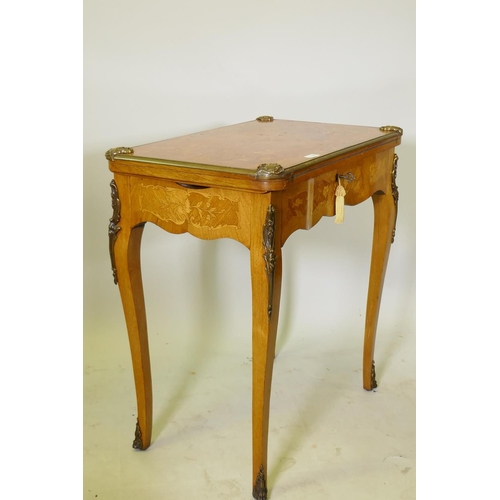 1150 - A French marquetry inlaid rosewood card table with brass mounts, the top slide back to reveal a writ... 