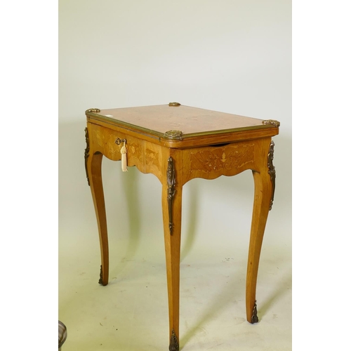 1150 - A French marquetry inlaid rosewood card table with brass mounts, the top slide back to reveal a writ... 