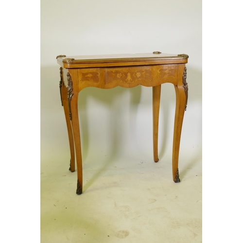 1150 - A French marquetry inlaid rosewood card table with brass mounts, the top slide back to reveal a writ... 