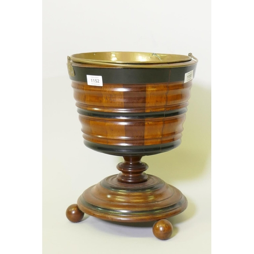 1152 - A Dutch fruitwood wine cooler with ebonised decoration and brass liner, 30cm diameter, 39cm high