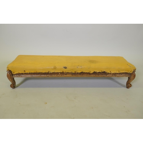 1157 - A C19th walnut footstool on carved cabriole legs, 98 x 28cm, 20cm high