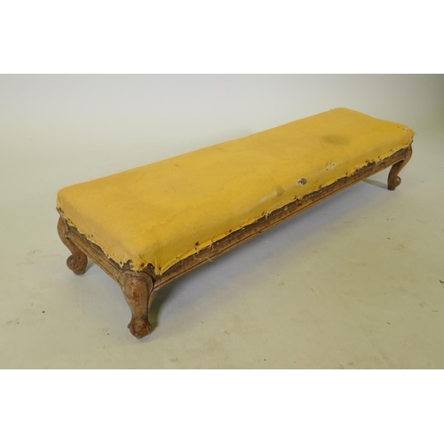 1157 - A C19th walnut footstool on carved cabriole legs, 98 x 28cm, 20cm high