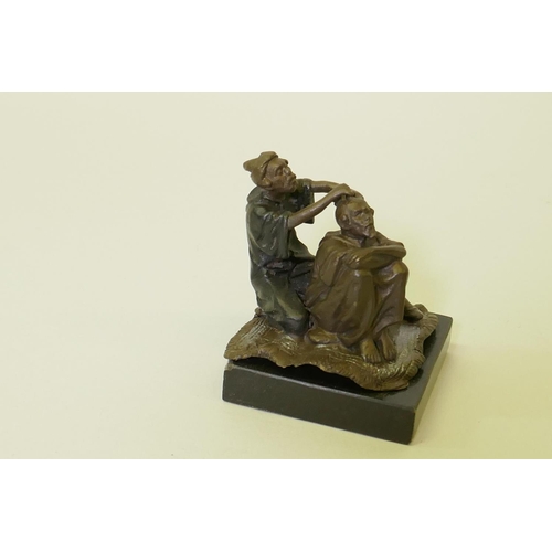 116 - Bronze figure of a barber with customer, mounted on a polished slate base, 8cm high