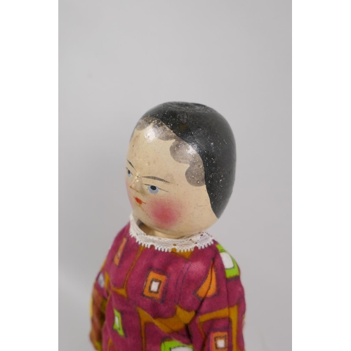 12 - A C19th German Grodnertal doll with hand painted hair, eyes, lips and cheeks, 37cm