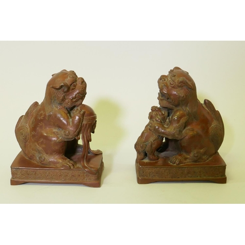 120 - A pair of bronze flat back figures of kylin, 17cm high