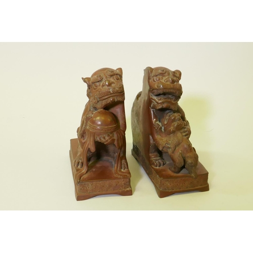 120 - A pair of bronze flat back figures of kylin, 17cm high