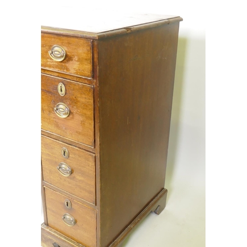 1200 - A Georgian mahogany kneehole desk, the seven drawers with cock beaded detail and original brass plat... 