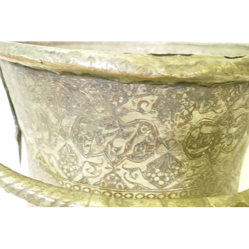 121 - A middle eastern silvered copper pot with chased decoration, 33cm high