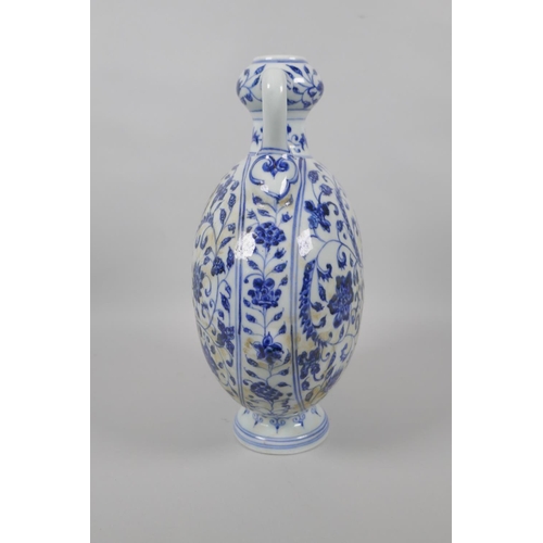 123 - A Chinese blue and white porcelain two handled garlic head shaped flask, with scrolling floral decor... 