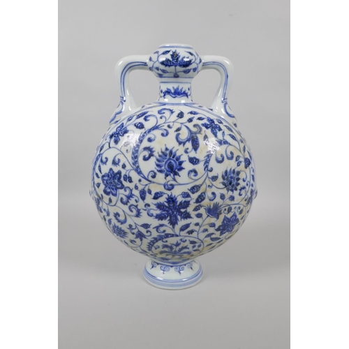 123 - A Chinese blue and white porcelain two handled garlic head shaped flask, with scrolling floral decor... 