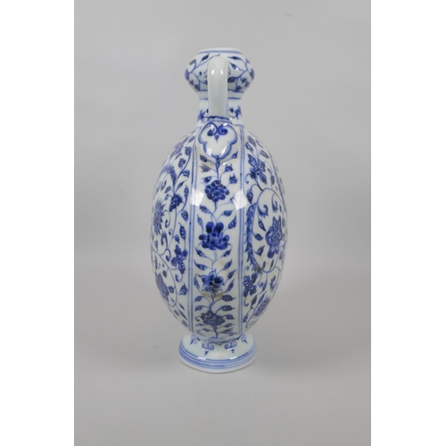 123 - A Chinese blue and white porcelain two handled garlic head shaped flask, with scrolling floral decor... 