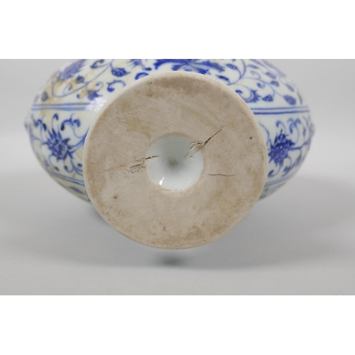 123 - A Chinese blue and white porcelain two handled garlic head shaped flask, with scrolling floral decor... 