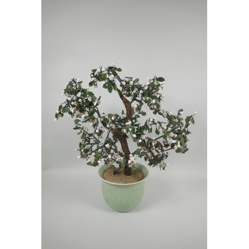 126 - A Chinese celadon glazed porcelain planter with imitation hardstone miniature tree, 45cm high