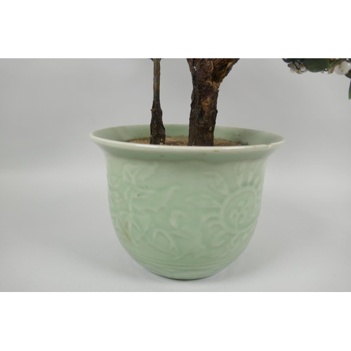 126 - A Chinese celadon glazed porcelain planter with imitation hardstone miniature tree, 45cm high