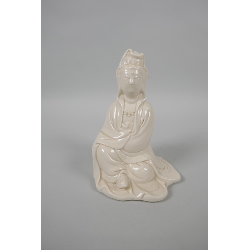 128 - A Chinese blanc de chine porcelain figure of Quan Yin, impressed mark verso, 13cm high