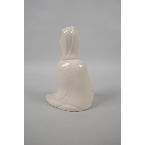 128 - A Chinese blanc de chine porcelain figure of Quan Yin, impressed mark verso, 13cm high