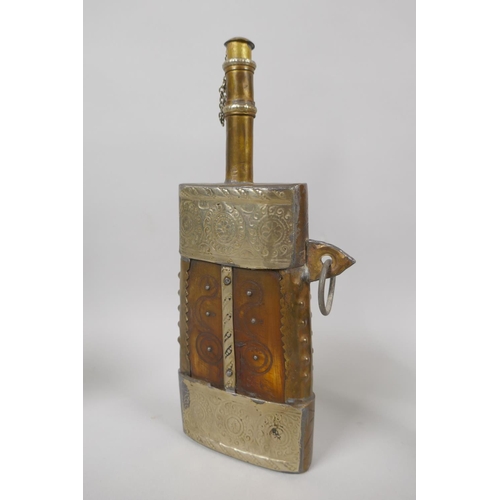 134 - An eastern brass mounted horn powder flask, a white metal mounted water sprinkler, a brass paper kni... 