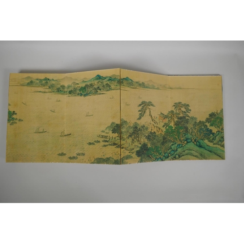 135 - A Chinese printed watercolour concertina book depicting an extensive riverside landscape scene, 18 x... 