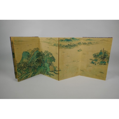 135 - A Chinese printed watercolour concertina book depicting an extensive riverside landscape scene, 18 x... 