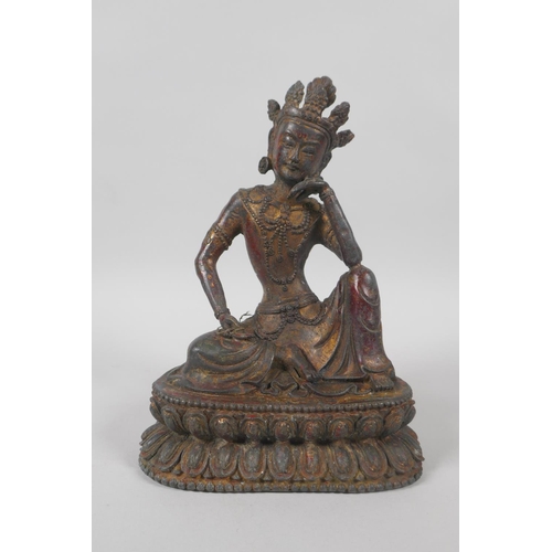 138 - A Tibetan bronze figure of Green Tara, with the remnants of gilt patina, 20cm high