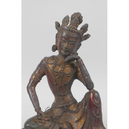 138 - A Tibetan bronze figure of Green Tara, with the remnants of gilt patina, 20cm high