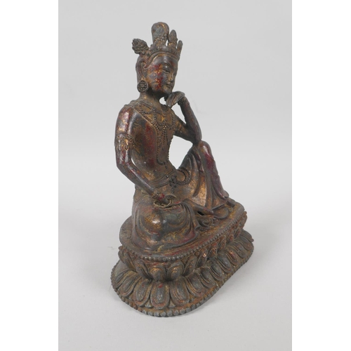 138 - A Tibetan bronze figure of Green Tara, with the remnants of gilt patina, 20cm high