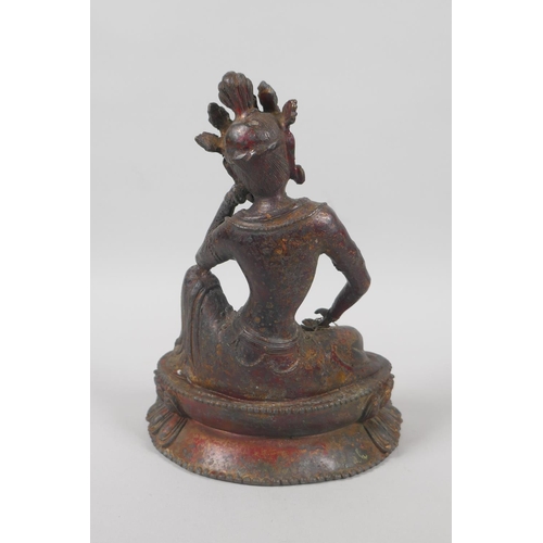 138 - A Tibetan bronze figure of Green Tara, with the remnants of gilt patina, 20cm high