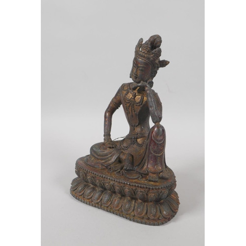 138 - A Tibetan bronze figure of Green Tara, with the remnants of gilt patina, 20cm high