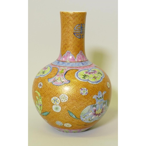 139 - A Chinese lustre glazed vase with enamel decoration, Qianlong seal mark to base, 28cm high