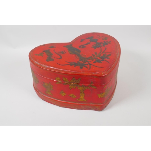 141 - A Chinese red lacquer heart shaped box, with gilt objects of virtue decoration, 32 x 26cm