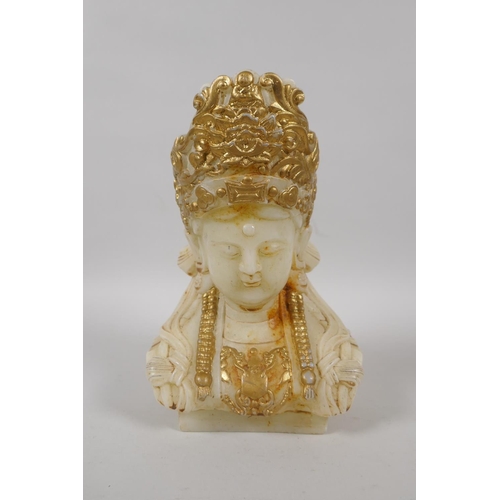 145 - A Chinese carved white hardstone bust of Guan Yin with  gilt highlights, 20cm high, a Peking gl... 