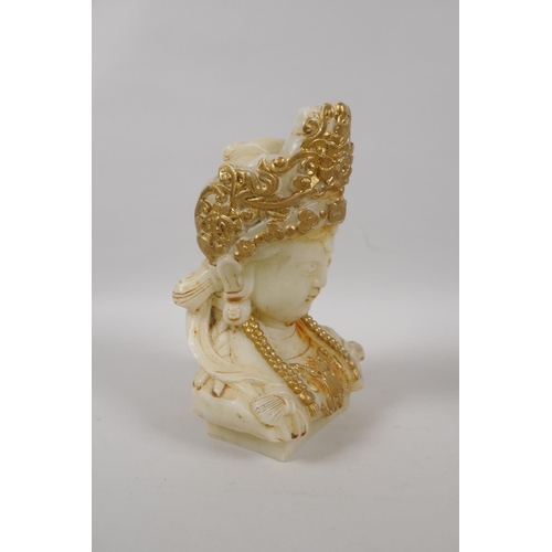 145 - A Chinese carved white hardstone bust of Guan Yin with  gilt highlights, 20cm high, a Peking gl... 