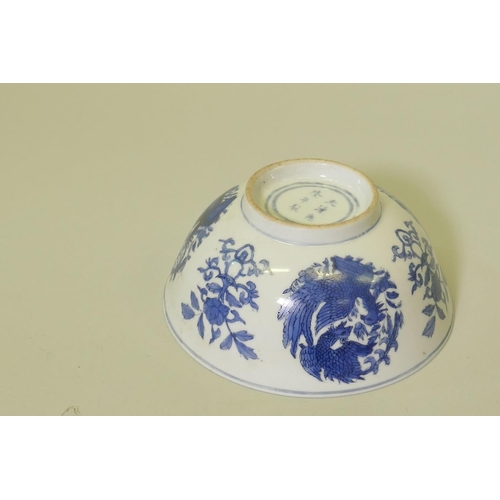 149 - A Chinese blue and white bowl with phoenix decoration, 15.5cm diameter