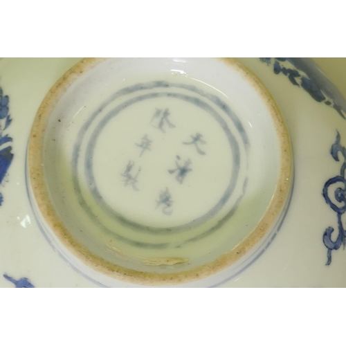 149 - A Chinese blue and white bowl with phoenix decoration, 15.5cm diameter