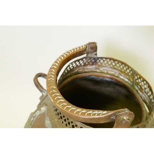 153 - Middle Eastern copper pot with applied brass decoration, raised on tripod supports, one detached, 50... 