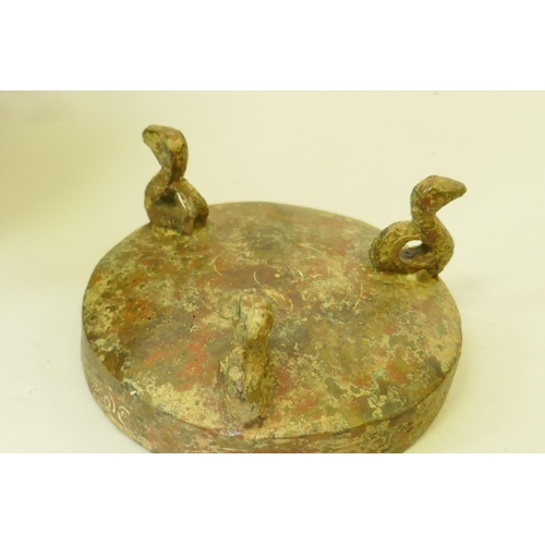 155 - A Chinese bronze vessel with chain handles and archaic style decoration, 20cm high