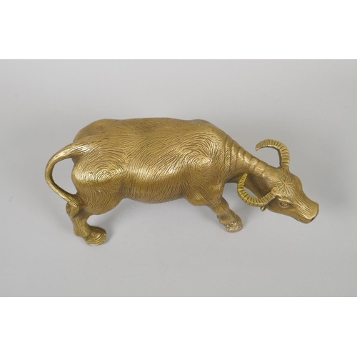 156 - A Chinese filled brass figure of a water buffalo, impressed 4 character mark to base, 26cm