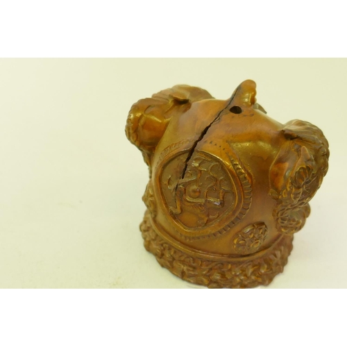 161 - A carved boxwood netsuke in the form of a foo lion, 5cm high, and a wood ball carved with a phoenix ... 