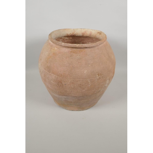 163 - A C19th Chinese terracotta pot with impressed decoration, 29cm high