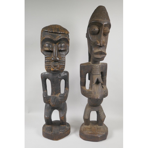 164 - Two African Democratic Republic of Congo carved wood Songye figures, a male and a female, largest 68... 