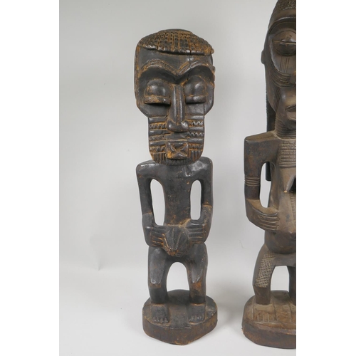 164 - Two African Democratic Republic of Congo carved wood Songye figures, a male and a female, largest 68... 