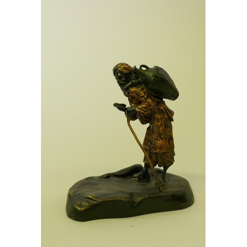 169 - Bronze figure of an Arab water carrier, 9cm high