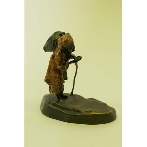 169 - Bronze figure of an Arab water carrier, 9cm high