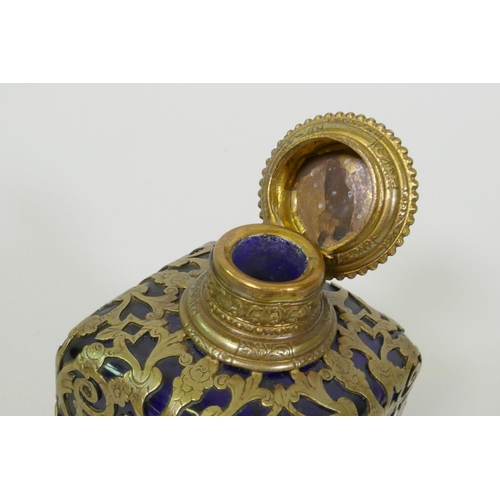 18 - A C19th French blue glass scent bottle with brass mounts, the top with inset miniature enamel painti... 