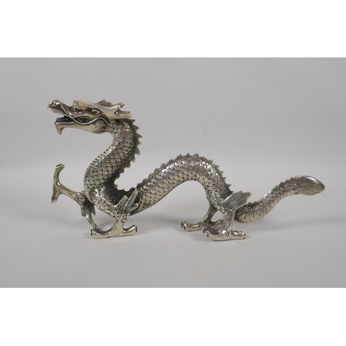 180 - A Chinese silvered metal figure of a dragon, 30cm