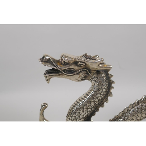 180 - A Chinese silvered metal figure of a dragon, 30cm