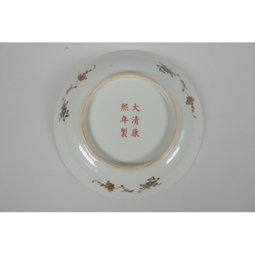 188 - A Chinese famille verte porcelain dish decorated with figures in a garden, KangXi 6 character mark t... 