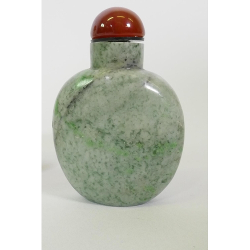 19 - A Chinese glass snuff bottle with reverse decoration of a landscape and flowering blossoms, 9.5cm hi... 