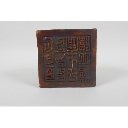 190 - A Chinese filled bronze seal decorated with kylin to the top, 10 x 10cm